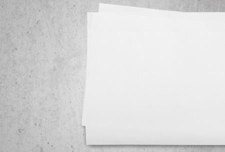 Close up of a crumpled unfolded piece of paper on white backgroundの写真素材