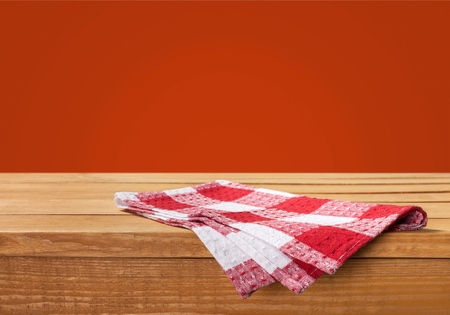Background with wooden table, tablecloth and  grunge red wallの写真素材
