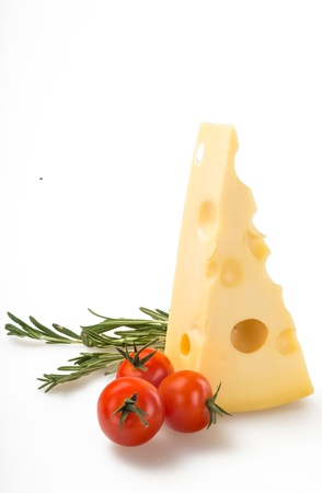 Piece of Yellow Cheese and Three Cherry Tomatoesの写真素材