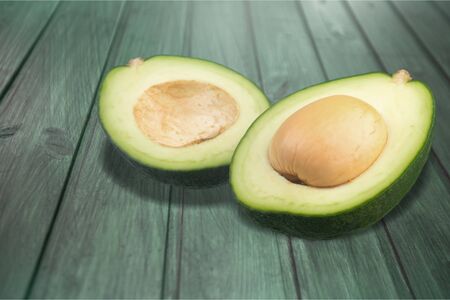 Seamless pattern with avocado. Tropical abstract background. Avocado the white background.