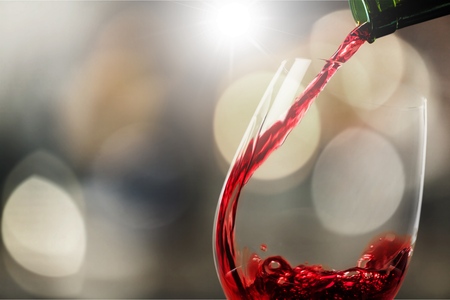 Pour red wineの写真素材