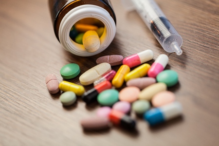 Drug prescription for treatment medication. Pharmaceutical medicament, cure in container for health. Pharmacy theme, capsule pills with medicine antibiotic in packages.の写真素材