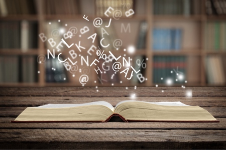 education and book concept - open book on the tableの写真素材