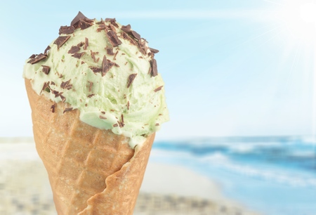 Strawberry ice cream with cone on white background