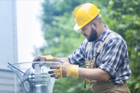 Technician operator checking reading value from pressure and temperature transmitter of oil and gas process to find abnormal condition, Offshore business and occupational.の写真素材