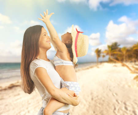 two pretty children kissing their mother happy smiling close up,の写真素材