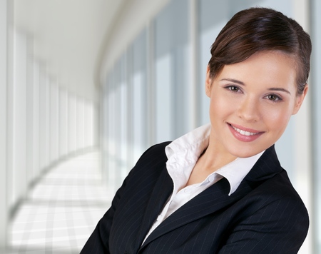 Confident young manager on white background