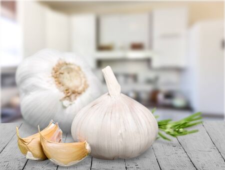 Garlic. Garlic Cloves and Garlic Bulb in vintage wooden bowl.の写真素材