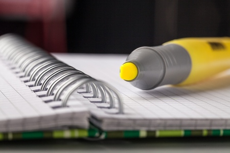 Yellow marker with notebookの写真素材