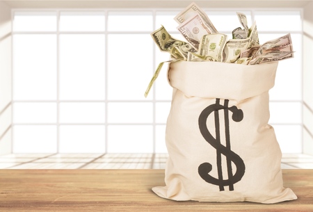 Money Bag with money on   background.の写真素材