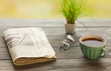 Newspaper on wooden tableの写真素材