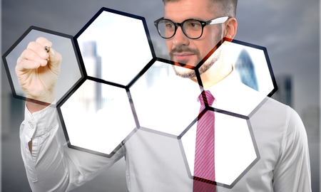Business process workflow illustrating management approval, flowchart with businessman in background