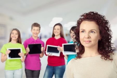Portrait of smart schoolkids standing in line and looking at camera