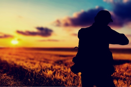 Turkey hunter silhouette at sunsetの写真素材