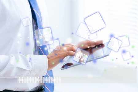 Unrecognizable business man holding a digital tablet