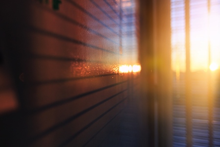 Empty the top of wood table with  blur  sunlight in window building.background.for product display and presentationの写真素材