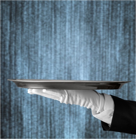 Butler Serving Empty Tray on Black
