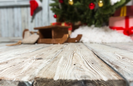 Christmas tree with vintage decorations near fireplaceの写真素材