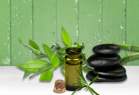 bottle of aromatic essence oil and fresh rosemaryの写真素材