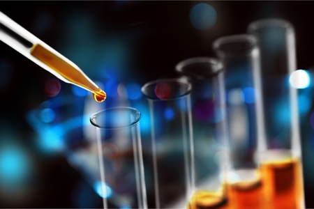 Laboratory research, dropping liquid to test tube