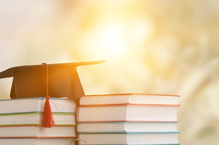 Graduation cap on Booksの写真素材