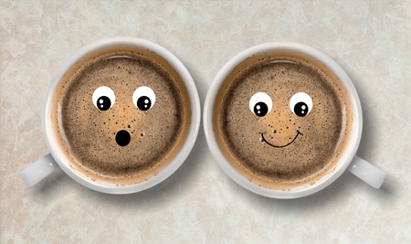 Coffee cup with happy facesの写真素材
