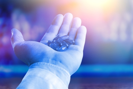 Medical hand holds medication drugの写真素材