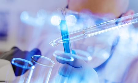 Scientist with test tubes