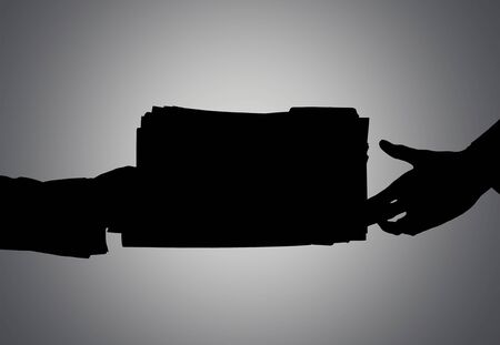Silhouette Of Hands Giving Bribe Against Gray Backgroundの写真素材