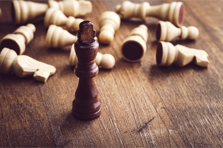 chess uniqueness concept on the wooden backgroundの写真素材