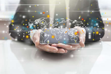 hand holding world mapの写真素材