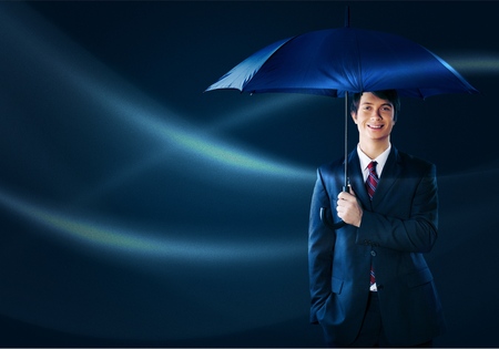 Businessman - Holding an unbrellaの写真素材