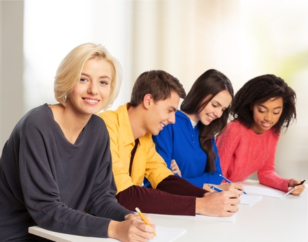 Happy Group Of Young Students Studying Together In Libraryの写真素材
