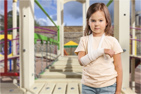 little boy in a cast.child with a broken arm. funny kid after accident.の写真素材