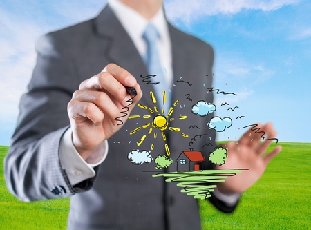 businessman hand drawing house in a whiteboardの写真素材