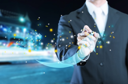 Businessman drawing on screenの写真素材