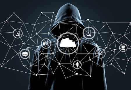 Thief in black on grey backgroundの写真素材