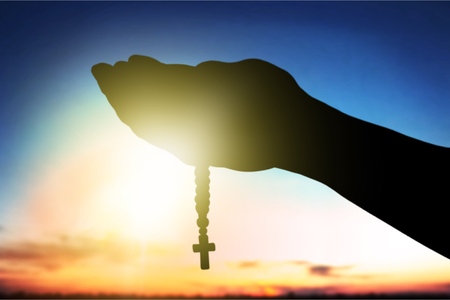 A human hands holding crossの写真素材