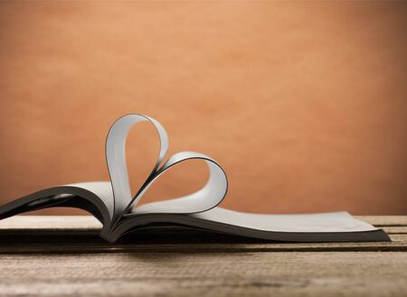Heart from a book page againstの写真素材