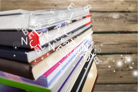 Stack of books on wooden background