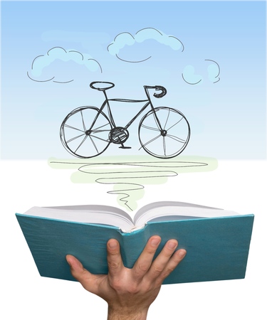 education and book concept - close up of woman hand holding open green bookの写真素材