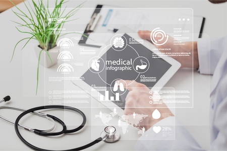 Woman doctor using tablet computer