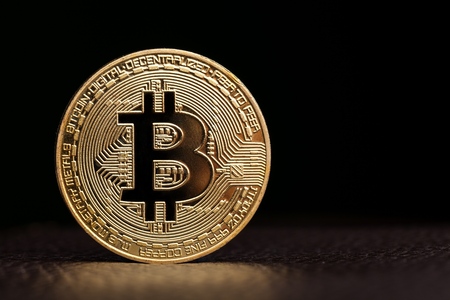 Golden color bitcoin on leatherの写真素材