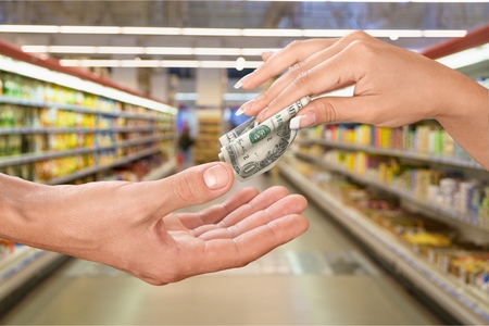 Male hand holding money