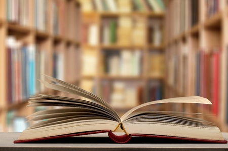 Open old book in libraryの写真素材