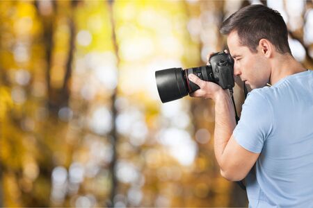 A Man looking in thre camera