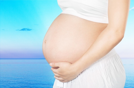 pregnant woman on the beach