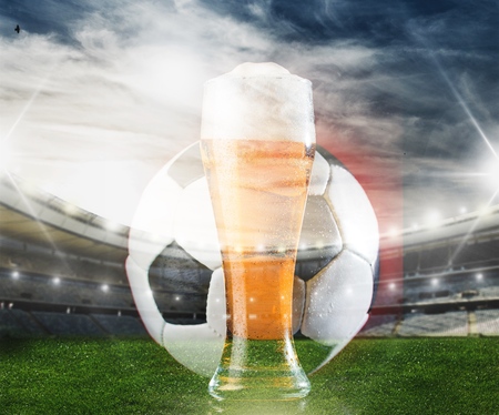 Glass of lager on stadium backgroundの写真素材