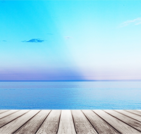 Wood, blue sea and sky background