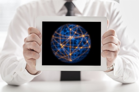 businessman hand working with modern technology digital tablet computer and digital layer effect as business strategy conceptの写真素材